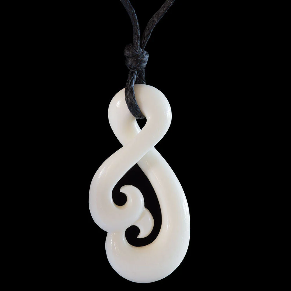 Twist Koru, handcrafted bone pendant